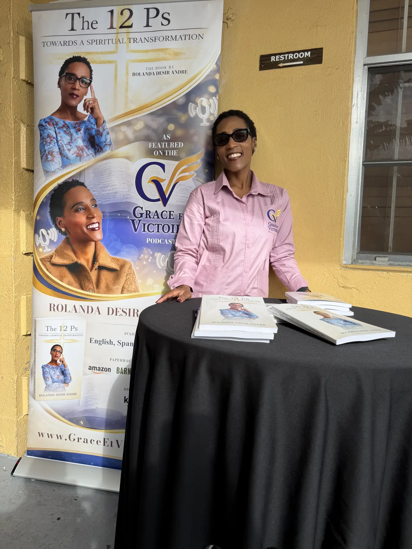 Rolanda standing beside The 12 P's and Grace et Victoire displays