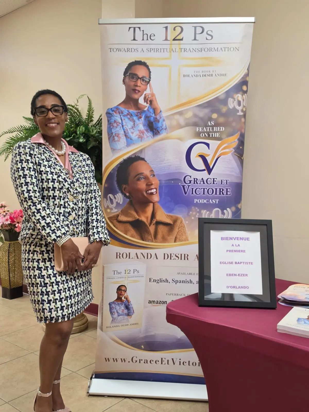 Rolanda Desir Andre beside The 12 P's display at Premiere Eglise Baptiste Ebenezer Orlando
